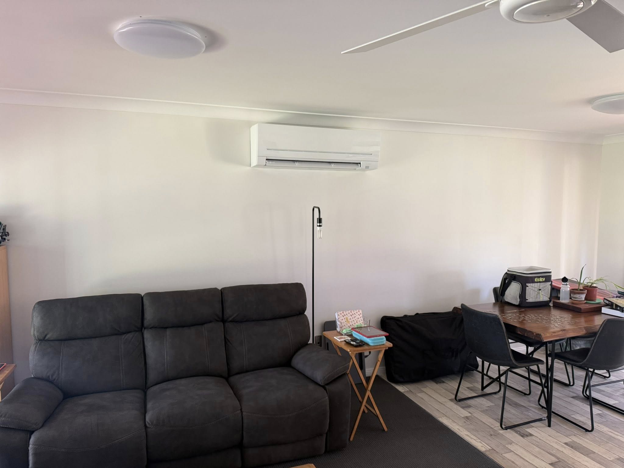 Wall mounted split system air conditioner installed in a living room